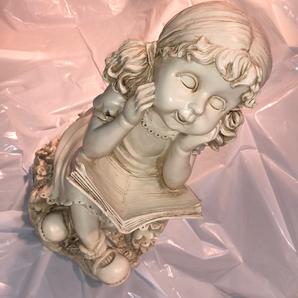Heavy Resin statue of a young girl reading a book. Ivory color. Tons of details